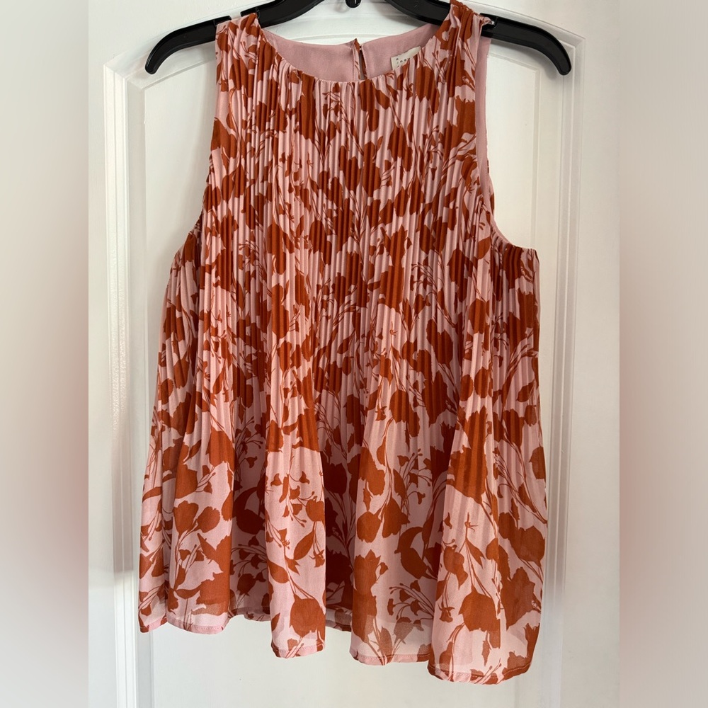 Size small sleeveless blouse. Worn a few times, but in great shape.